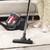 Vacuum cleaner floor head on light wood flooring