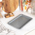 Grey speckled non-stick baking tray, shown from above