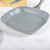 Grey square non-stick grill pan with speckled finish for stovetop cooking