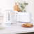 White textured kettle and toaster set on kitchen counter with sliced bread
