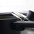 Grey saucepan with lid, shown from side on kitchen counter