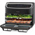 Black Salter air fryer oven with digital display, open door, cooking vegetables and chicken inside