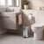 Modern bathroom with wall-hung vanity, toilet and silver pedal bin