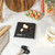 Black digital kitchen scale with display showing weight, Salter branding