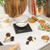 Boxed Salter Arc Electronic Kitchen Scale, black, with bowl of berries on front