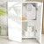White bathroom cabinet with open door showing scales, sponge, and toilet rolls on shelves
