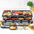 Salter raclette grill with hot plate, featuring assorted meats, vegetables and cheese pans, shown in kitchen setting