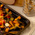 Tray of assorted roasted vegetables including squash, peppers and garlic