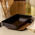 Black speckled rectangular roasting tin on kitchen counter