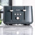 Salter dark grey 4-slice toaster with cancel, reheat, and defrost buttons on kitchen counter