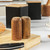 White and wood effect Salter toaster with two slices of bread, salt and pepper shakers.