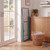 Folded blue clothes airer leaning against cupboard in laundry room