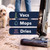 Cordless floor cleaner vacuuming muddy paw prints on hard floor
