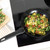 Black non-stick frying pan with handle, shown from above