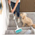 Carpet cleaning roller with handle used on grey carpeted stairs