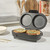 Electric pie and quiche maker with two savoury pastries cooking in a modern kitchen