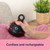 Cordless rechargeable fabric shaver removing bobbles from pink garment