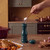 Green salt or pepper mill in kitchen setting