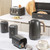 Salter black and gold kettle, tea caddies, toaster and bread bin in modern kitchen setting