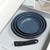 Set of three blue non-stick frying pans with detachable handle in kitchen drawer