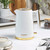 White and gold electric kettle on kitchen worktop, modern ribbed design