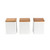 Set of three white storage canisters with natural wood lids, shown front view