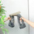 Electric window vacuum cleaner shown cleaning a bathroom mirror