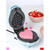 Light blue Easter egg waffle maker with waffle inside, spring decor and sweets