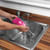 Hand wipes sauce with pink microfibre pad on grey worktop