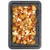 Roasted baby potatoes on tray with feta cheese and red chilli slices
