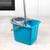 Blue plastic mop bucket with grey wringer and mop, shown on tiled kitchen floor.