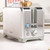 Silver 2-slice toaster with cancel, reheat and defrost buttons on kitchen counter