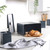 Matte black bread bin with loaf of bread on modern kitchen worktop, matching storage canisters