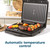 Open black contact grill cooking steak and vegetable skewers