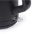 Close-up of black electric kettle power switch and handle
