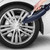 Steam cleaner cleaning silver alloy car wheel