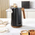 Black electric kettle with wood-effect handle on kitchen worktop