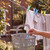 Laundry peg basket with hand taking peg, clothes on washing line outdoors