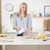White handheld electric mixer with chrome detail and beater, side view