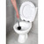 Stainless steel toilet brush holder with lid, photographed front-facing.