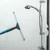 Shower squeegee cleaning glass shower screen with soap suds visible