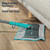 Flat mop with 360° swivel head reaching under grey sofa, shown on wooden floor