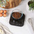 Black digital kitchen scale with clear display, shown on countertop