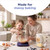 Adult and child baking together in kitchen with mixing bowl on digital scales