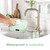 Green waterproof washable bib being rinsed under kitchen tap