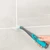 Electric toothbrush replacement head with blue and white bristles, upright on white background