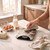 Digital kitchen scale with stainless steel platform on marble worktop