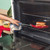 Red non-stick frying pan, base facing up showing induction-compatible bottom.