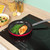 Red non-stick frying pan with silver handle, shown from above