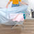 Blue waterproof cover on indoor clothes airer, showing full coverage for drying protection